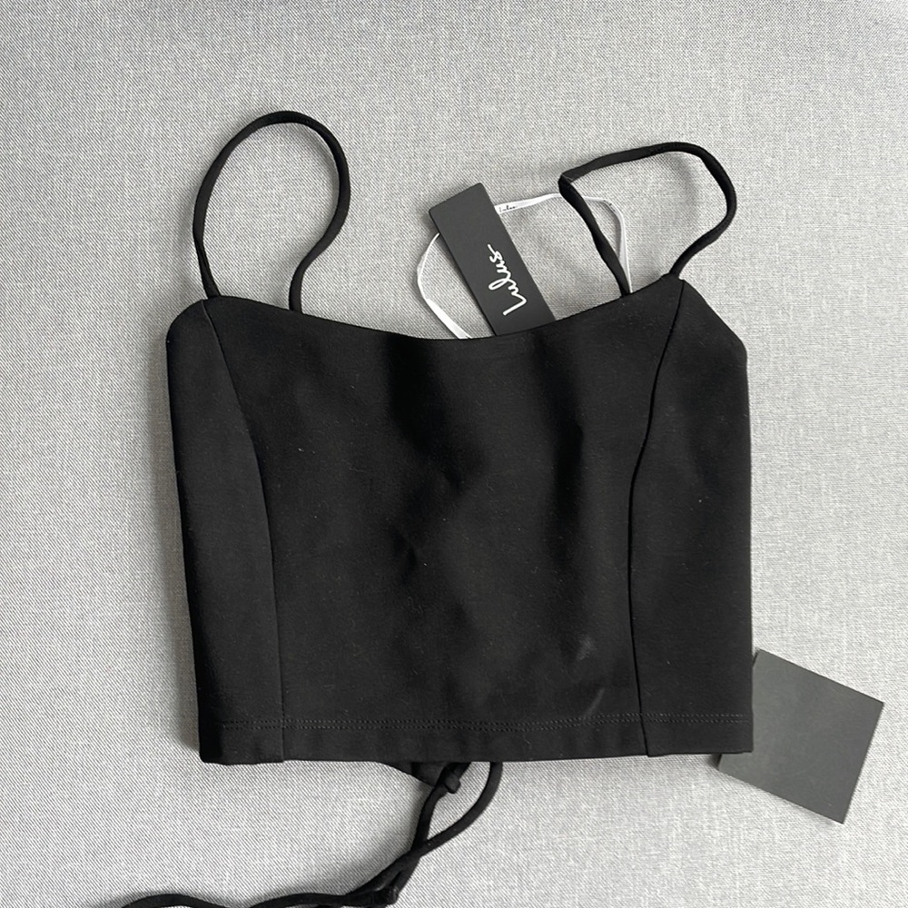 Black tank crop top with back detail and back tie, never worn, thick material